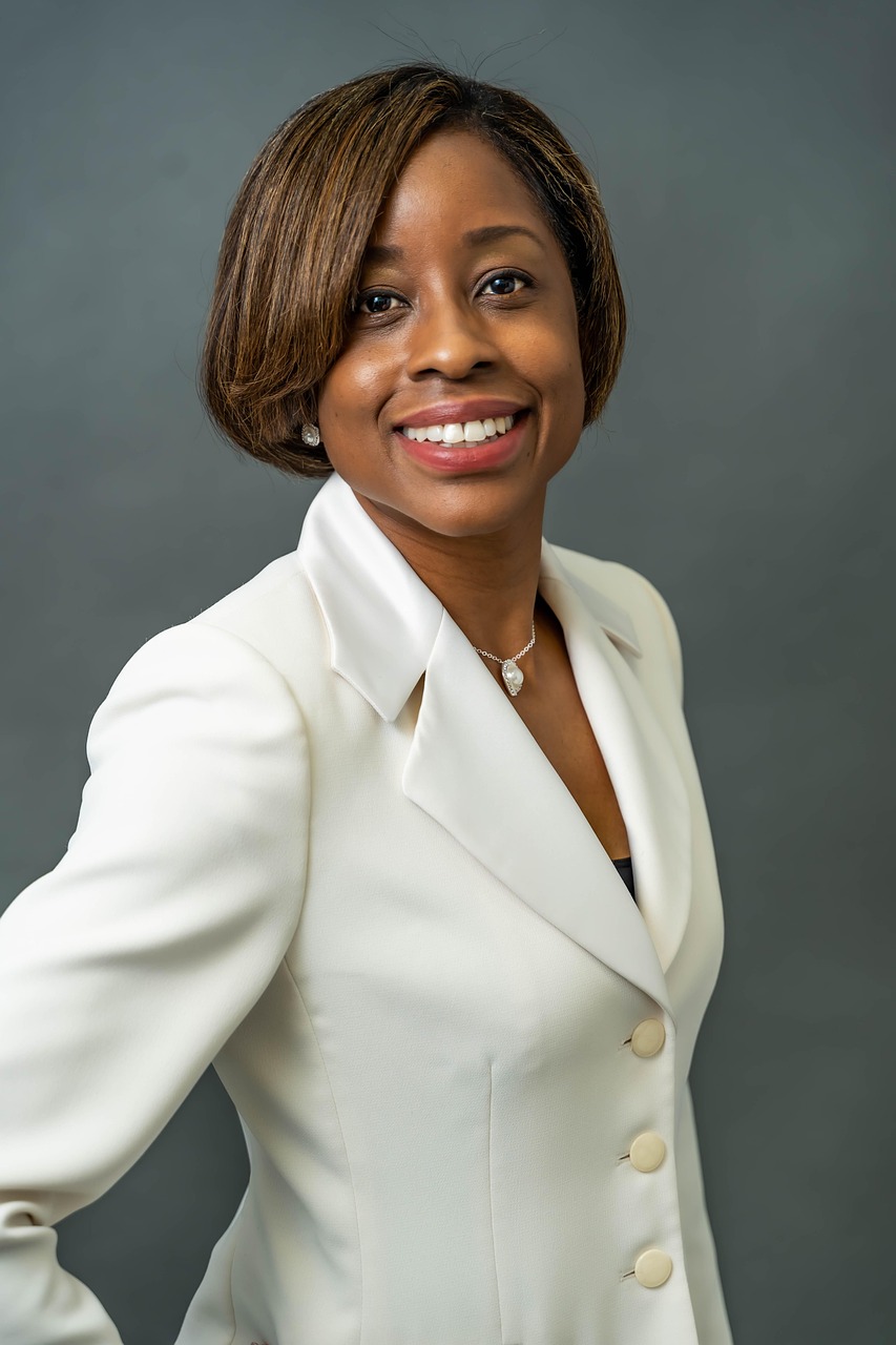 Confident mature Black woman in white suit